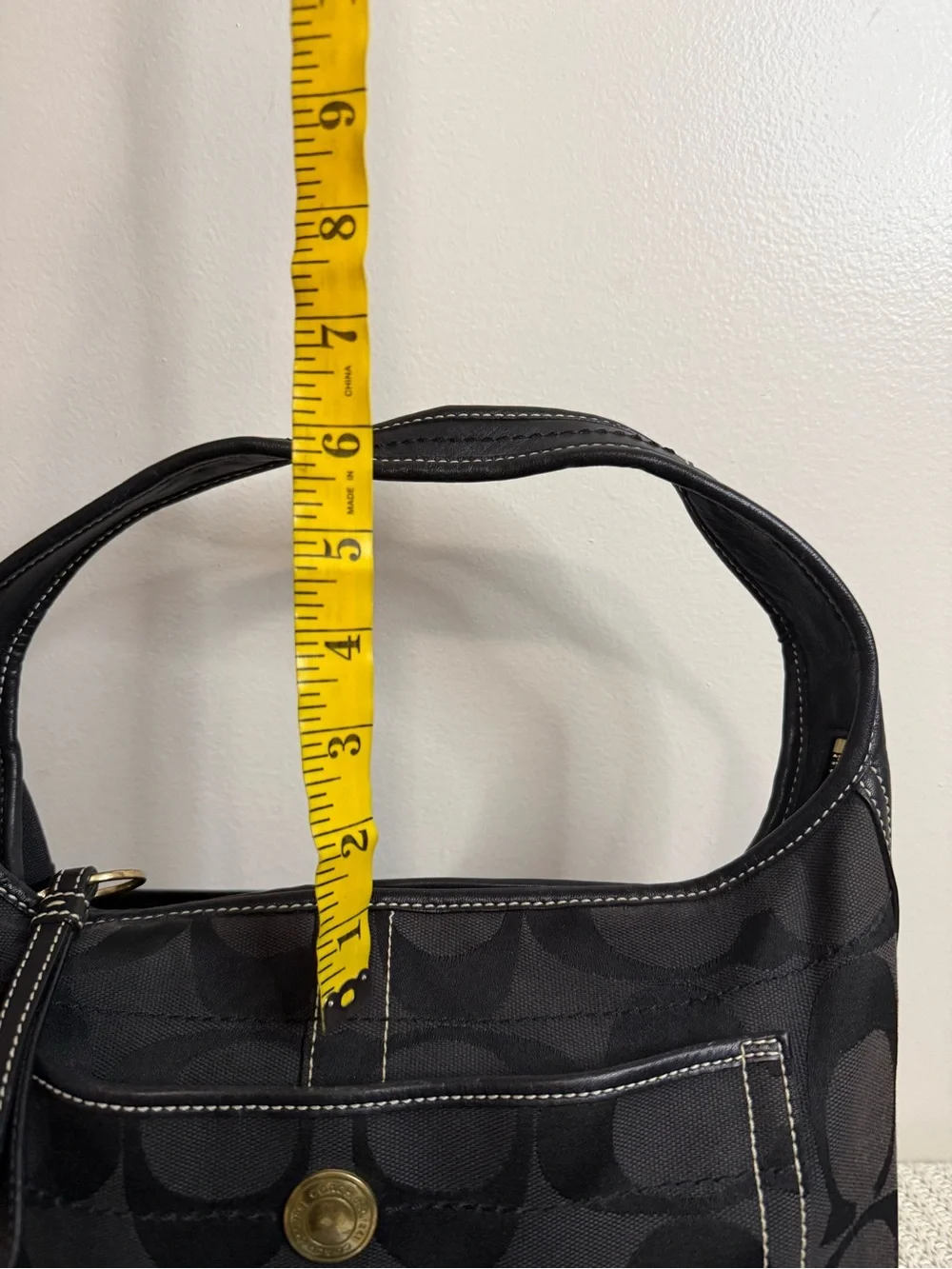 Coach Ergo Signature Jacquard Hobo bag featuring a black-on-black